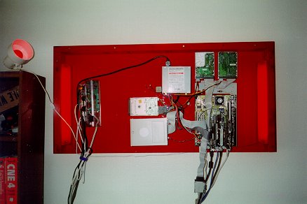 Computer parts mounted on a backlit sheet of plexiglass